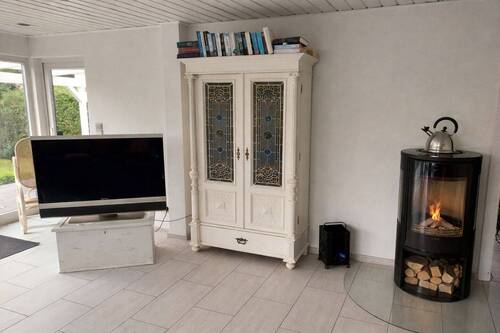 Wohnzimmer mit Kaminofen - 