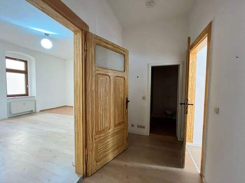Erdgeschosswohnung mit Balkon - 