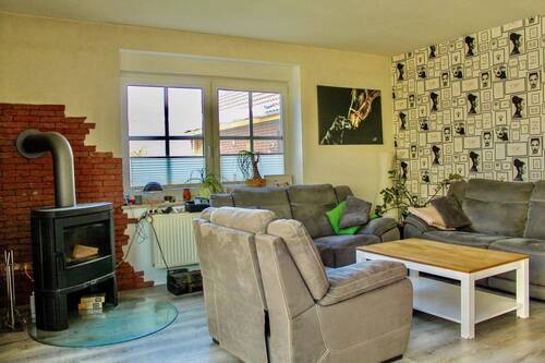 Wohnzimmer mit Kamin - Einfamilienhaus mit 160,00 m&sup2; in Westerholt zum Kaufen