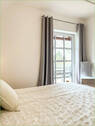 Schlafzimmer mit Zugang zum Balkon - 