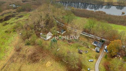 Außenansicht Drohne 5 - Großflächiges Grundstück mit Seezugang, Bestandsgebäuden und hohem Entwicklungspotenzial