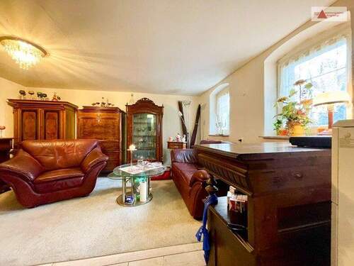 Wohnzimmer mit Dauerbranndofen EG - 