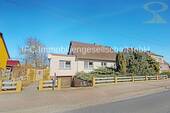 Hausansicht / Straßenseite - Einfamilienhaus mit Einliegerwohnung und Nebengelass in Jessen (Elster) OT Holzdorf