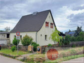 Außenansicht - Teilmodernisiertes Einfamilienhaus mit überdachter Terrasse, Nebengelass, Garage + großem Grundstück