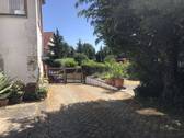 Einfahrt zum Grundstück - Einfamilienhaus mit 120,00 m² in Stößen zum Kaufen