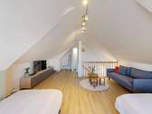 Wohn- und Schlafbereich im ausgebauten Dachgeschoss - 
