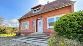 Bild 1 - Einfamilienhaus mit Einliegerwohnung in Neuenhaus; + Baugrundstück-Potenzial
