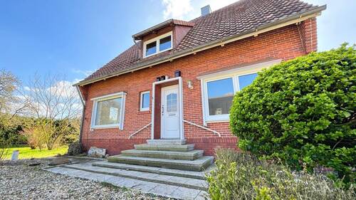 Bild 1 - Einfamilienhaus mit Einliegerwohnung in Neuenhaus; + Baugrundstück-Potenzial