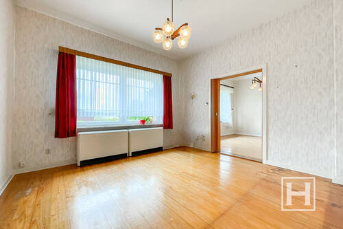 Wohnzimmer mit Blick ins Esszimmer - 4 Zimmer Einfamilienhaus in Tensfeld