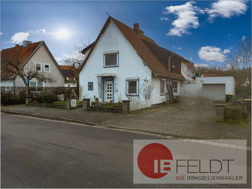 Straßenansicht - *Provisionsfrei* Werkssiedlungs-Einfamilienhaus mit Anbau und Garage in ruhiger Lage von Petershagen