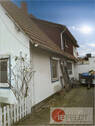 Seitenansicht zum Stellplatz und Garage - Einfamilienhaus mit 173,00 m² in Petershagen zum Kaufen