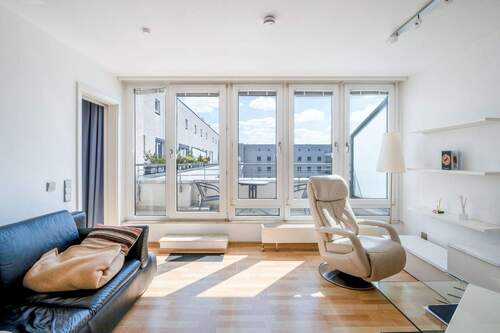 Wohnbereich mit Terrassenzugang - Vermietetes City-Apartment mit Terrasse in bester Mitte-Lage