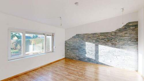 Wohnzimmer mit Steinwand - 