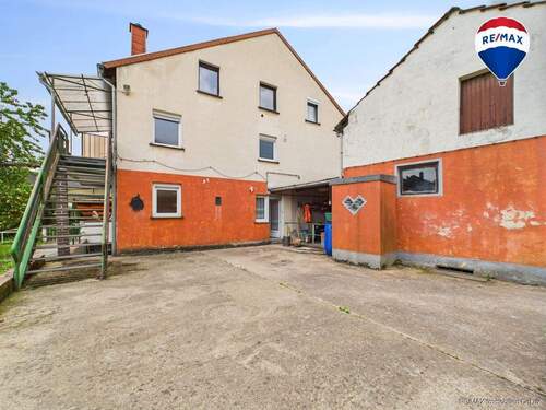 RE/MAX Immobilien DeLux Haus Merzig / Besseringen Rückansicht - 9 Zimmer Einfamilienhaus zum Kaufen in Merzig / Besseringen