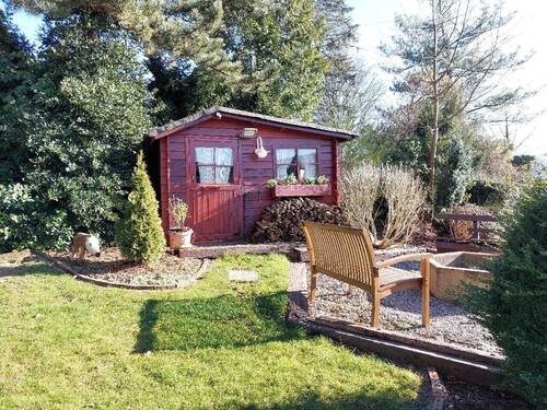 Die Gartenhütte mit zusätzlichem Sitzplatz - 