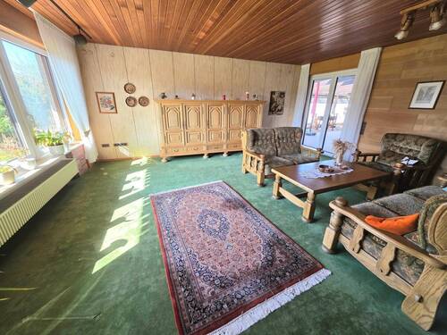 Wohnzimmer mit Zugang Terrasse EG - 