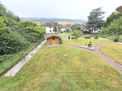 Garten - Einfamilienhaus mit 137,00 m&sup2; in Bad Emstal / Sand zum Kaufen