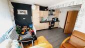Wohnzimmer mit offener Küche - 4 Zimmer Etagenwohnung zum Kaufen in Kippenheim