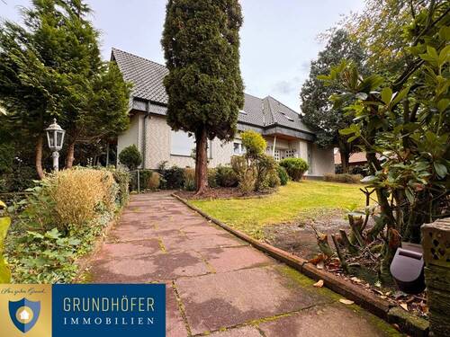 1 - Zweifamilienhaus mit parkähnlichem Grundstück in traumhafter Lage in Bösel