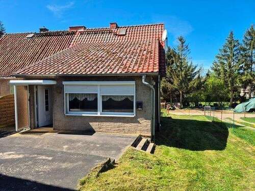Gartenansicht mit Terrasse - Mehrfamilienhaus, Wohnhaus in Feldberger Seenlandschaft