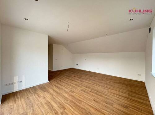 Offener Wohn-Ess-Küche mit Zugang zum Balkon - Etagenwohnung mit 76,60 m² in Vechta zum Kaufen