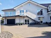 Anbau mit Doppelgarage - Einfamilienhaus mit 560,00 m² in Hille zum Kaufen