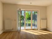 Das Wohnzimmer mit Balkon - und Gartenzugang - Reihenmittelhaus mit 125,00 m² in Klein Trebbow / Barner Stück zur Miete
