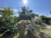 Blick in Garten - Etagenwohnung mit 88,00 m² in Thiendorf zum Kaufen