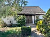 Hausansicht mit Garage - Einfamilienhaus mit 85,90 m² in Blomberg zum Kaufen