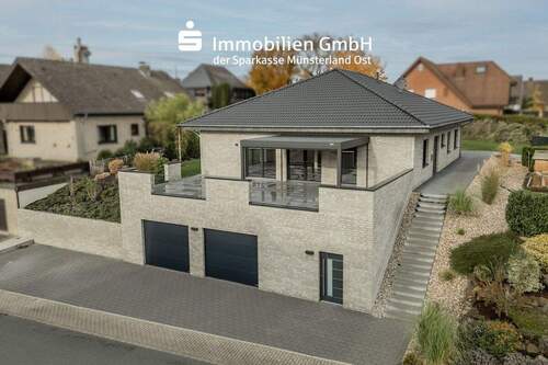 Vogelperspektive - Neuwertiger Bungalow mit hoher Lebensqualität in Beckum!