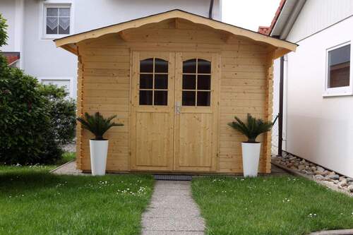 Multifunktionales Gartenhaus: Stauraum und Wohlfühloase in Holzbauweise - 