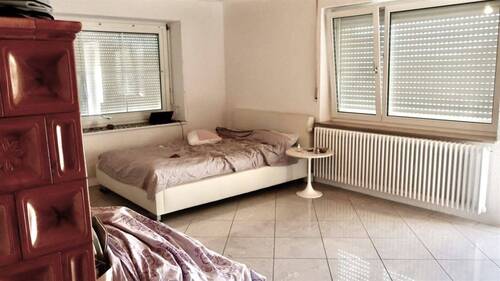 Wohnzimmer mit Kachelofen OG - 