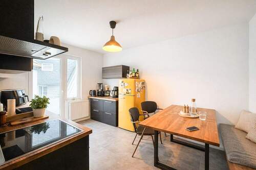 Küchenbereich mit Balkon - Etagenwohnung mit 57,10 m&sup2; in Düsseldorf zum Kaufen