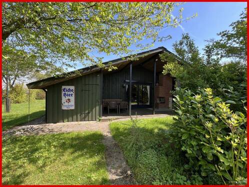 Westansicht mit überdachter Terrasse - 