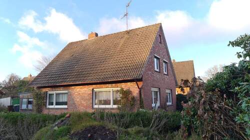 Außenansicht Rückseite - Einfamilienhaus in Bockhorn - 139.000,00&nbsp;EUR Kaufpreis, ca.&nbsp; 135,00&nbsp;m&sup2;&nbsp;Wohnfl&auml;che