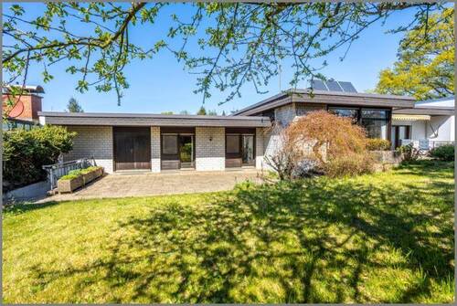 Hausansicht Südseite - Exklusives EFH! Ein Raumwunder als doppelter Bungalow plus TG!