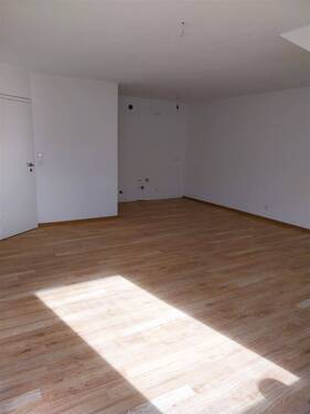 Wohnzimmer mit Blick zur offenen Küche - Etagenwohnung mit 59,60 m&sup2; in Wildeshausen zur Miete
