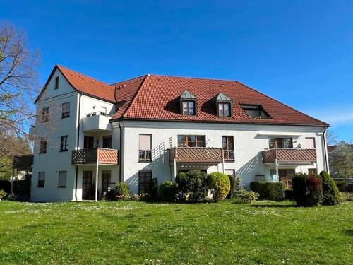 Hausansicht - RUHIGE, VERMIETETE EIGENTUMSWOHNUNG MIT GARTEN