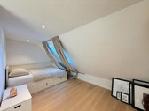 Behagliches Schlafzimmer im Dachgeschoss - 