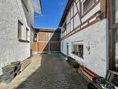 Hofeinfahrt - Einfamilienhaus mit 264,00 m&sup2; in Wölfersheim / Wohnbach zum Kaufen