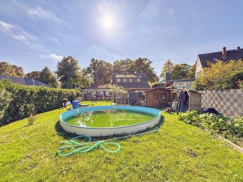 Gartenansicht - Mehrfamilienhaus, Wohnhaus mit 218,00 m² in Ritterhude zum Kaufen