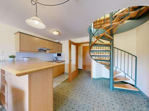 Offener Küchenbereich mit Wendeltreppe - Etagenwohnung mit 76,00 m&sup2; in Kühlungsborn zum Kaufen