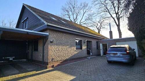 Hof mit Garage und Carport - Mehrfamilienhaus, Wohnhaus mit 210,00 m&sup2; in Ganderkesee zum Kaufen