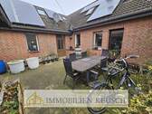 Große Terrasse am Haus - Doppelhaushälfte mit 145,10 m&sup2; in Twistringen zum Kaufen