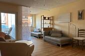 Wohnzimmer mit Schlafbereich - 1 Zimmer Etagenwohnung in Butjadingen