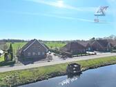 tolle Kanallage - 6 Zimmer Mehrfamilienhaus, Wohnhaus in Uplengen / Nordgeorgsfehn