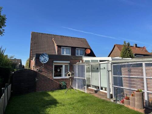 Rückansicht - 6 Zimmer Mehrfamilienhaus, Wohnhaus in Schortens