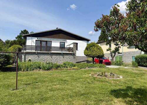 Garten Blick auf Haus - Einfamilienhaus mit 108,90 m&sup2; in Ottendorf-Okrilla zum Kaufen