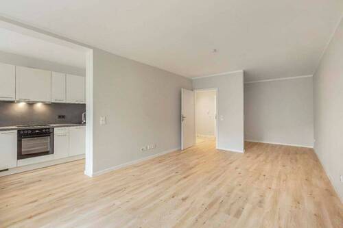 Wohnzimmer - 1-Zimmer-Erdgeschosswohnung mit Einbauküche in gefragter Neusser Lage