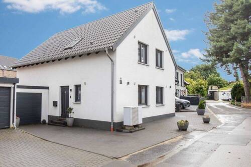 Hausansicht links - Einfamilienhaus mit 153,50 m&sup2; in Grevenbroich / Barrenstein zum Kaufen